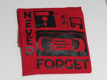 Load image into Gallery viewer, Black ink Never Forget design with cassette, VHS, and retro icons on red unisex short sleeve Chozzen Few cotton T-shirt