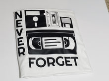 Load image into Gallery viewer, Black ink Never Forget design with cassette, VHS, and retro icons on white unisex short sleeve Chozzen Few cotton T-shirt 